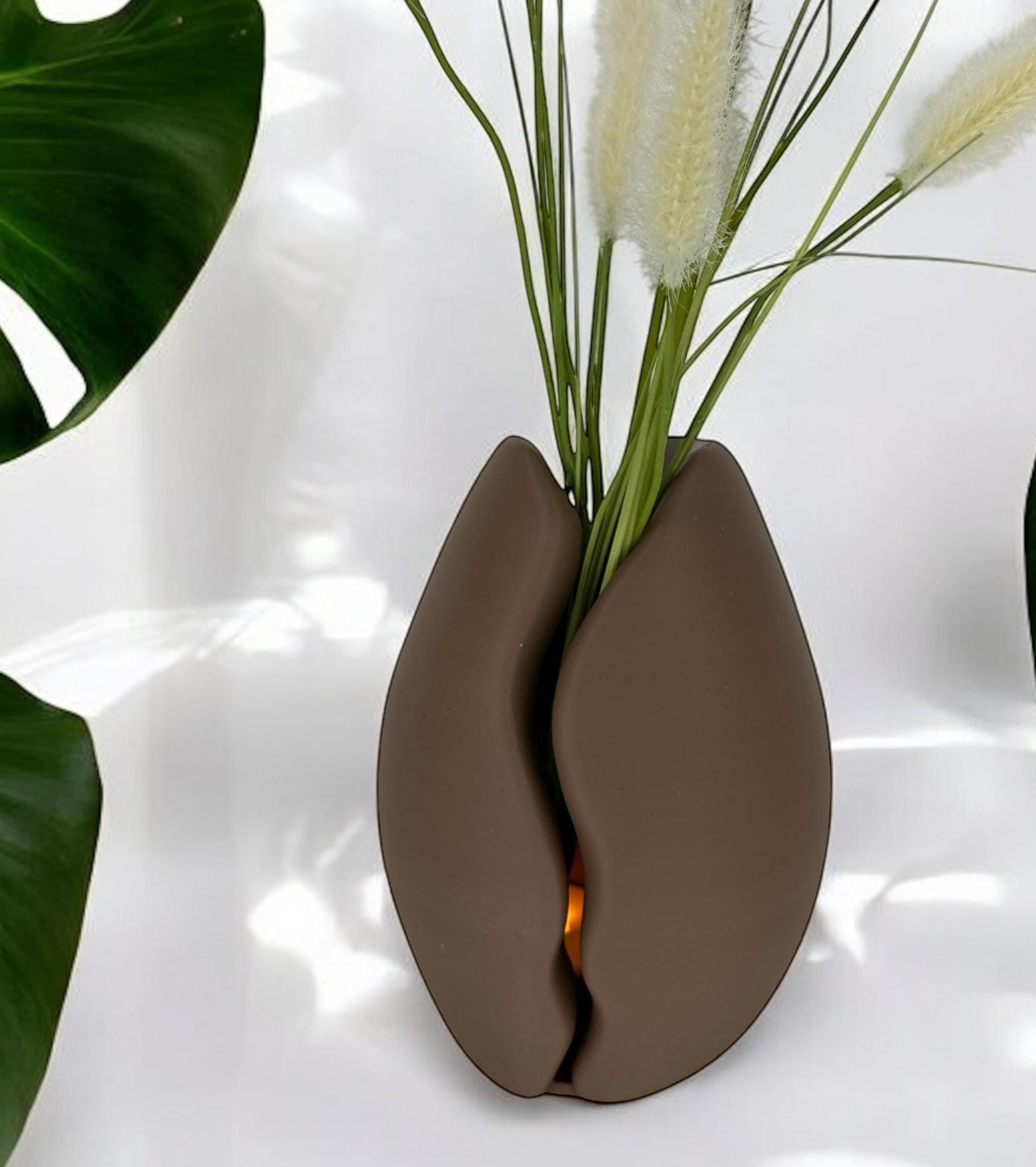 Brown Coffee Bean Vase styled with daisies in coffee shop interior