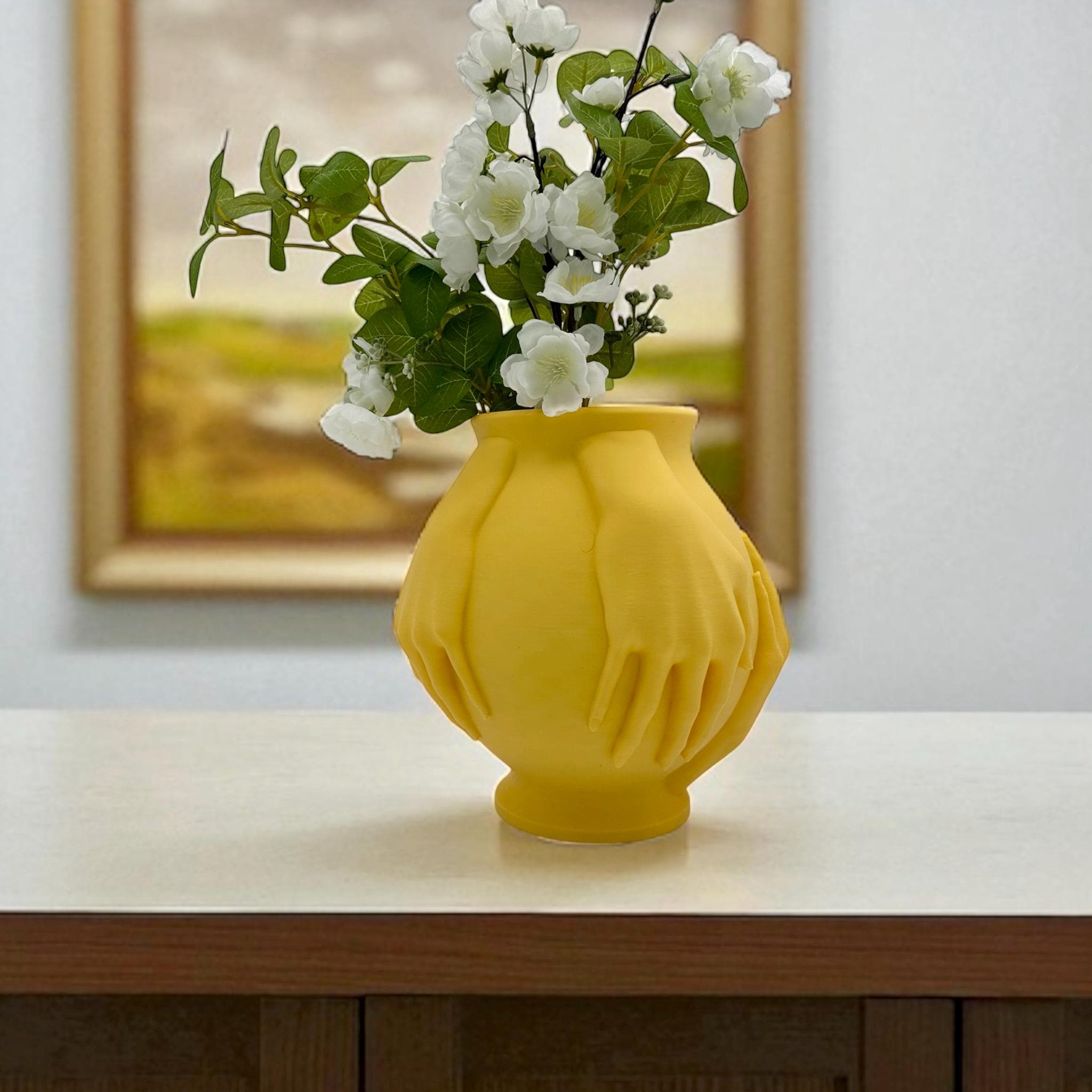 Yellow Multi-Hand Vase styled with neutral florals – sculptural figural decor