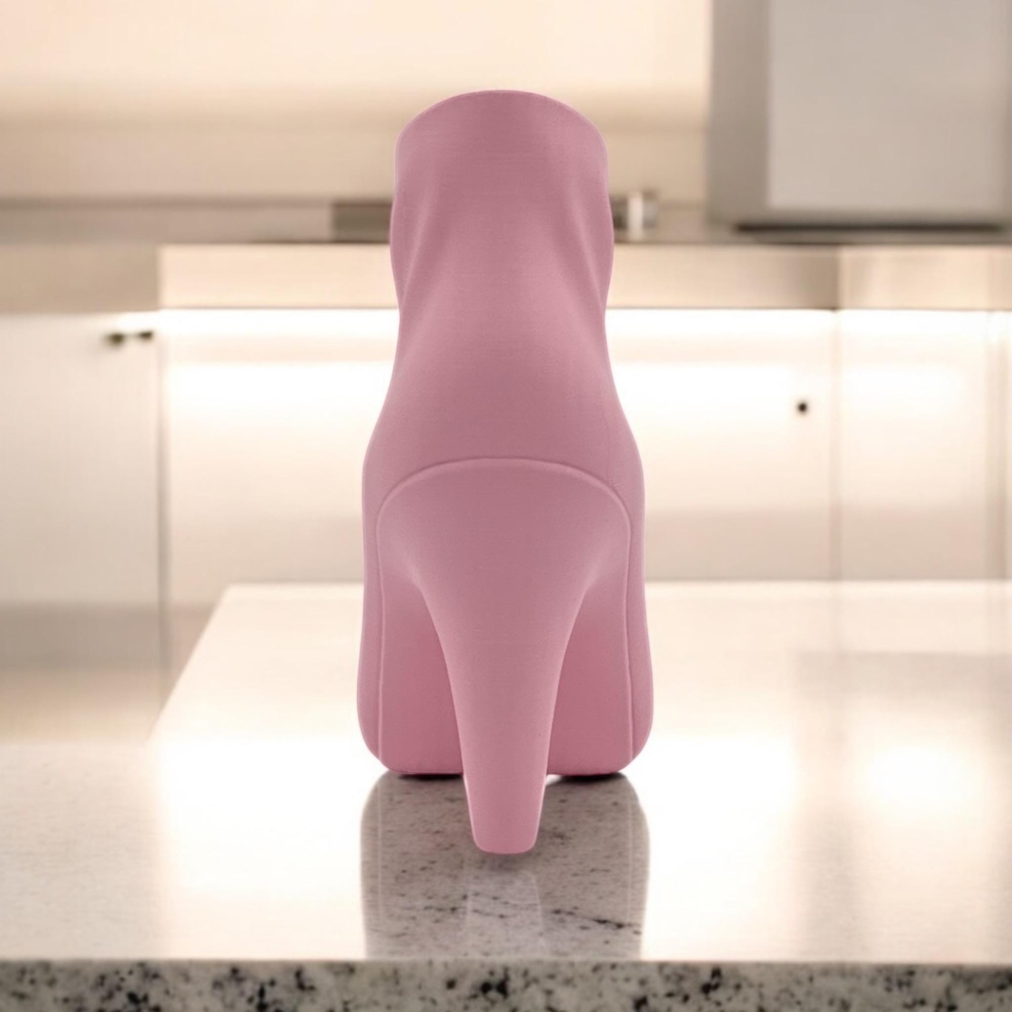 Pink High Heel Vase on shelf – figural boot sculptural decor