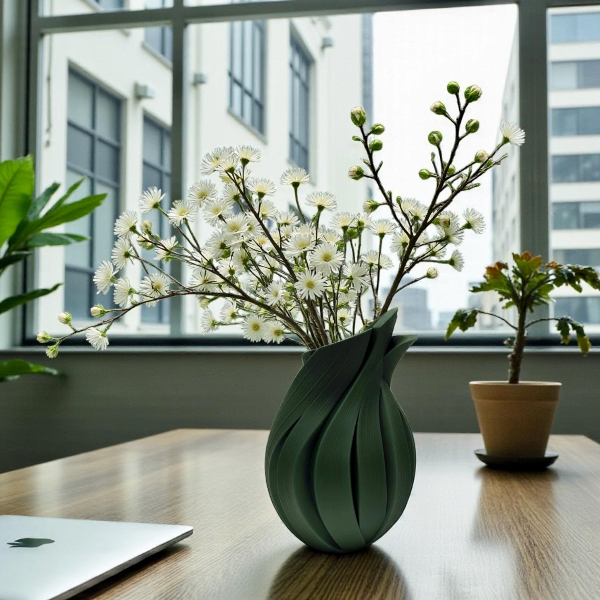 Black Flame Vase with white lilies on dining table – twisted sculptural centerpiece