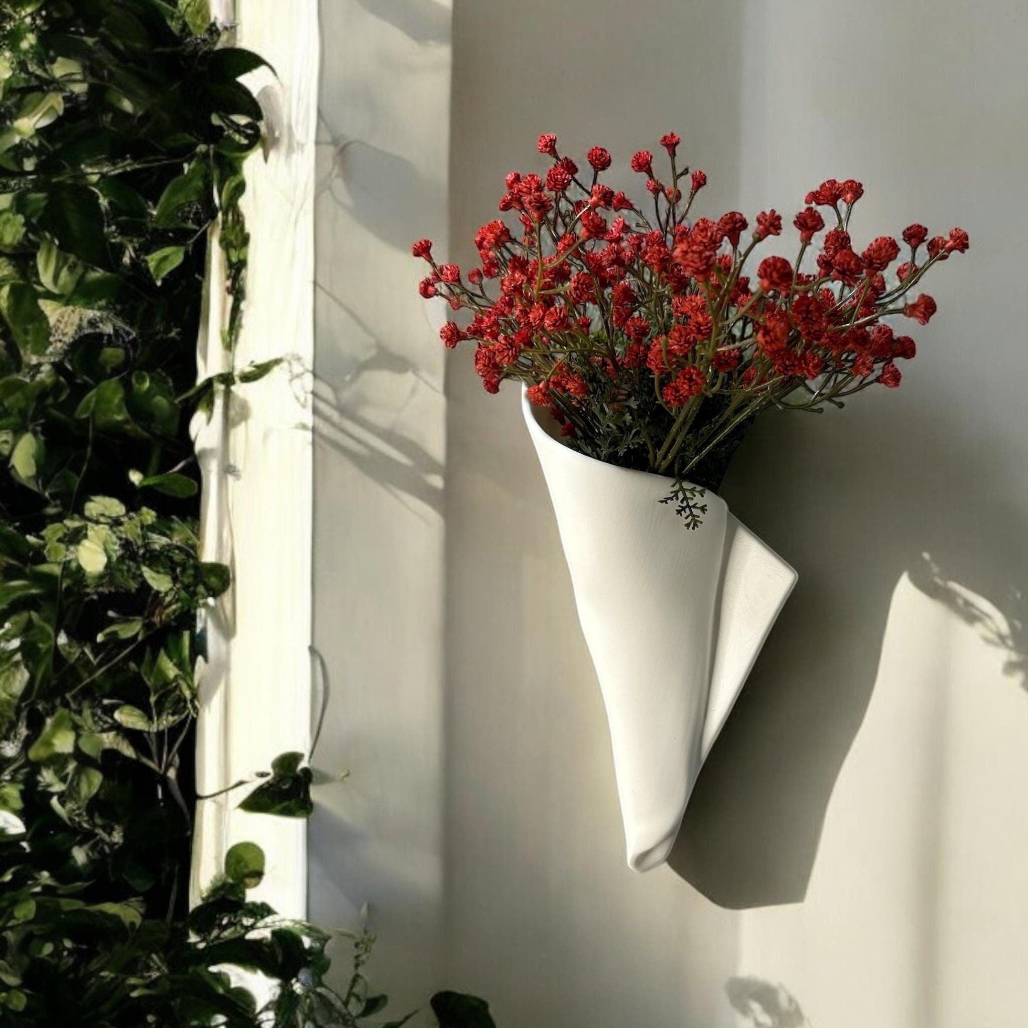 White vertical wall napkin wall vase displayed as modern wall decor by Pashmation