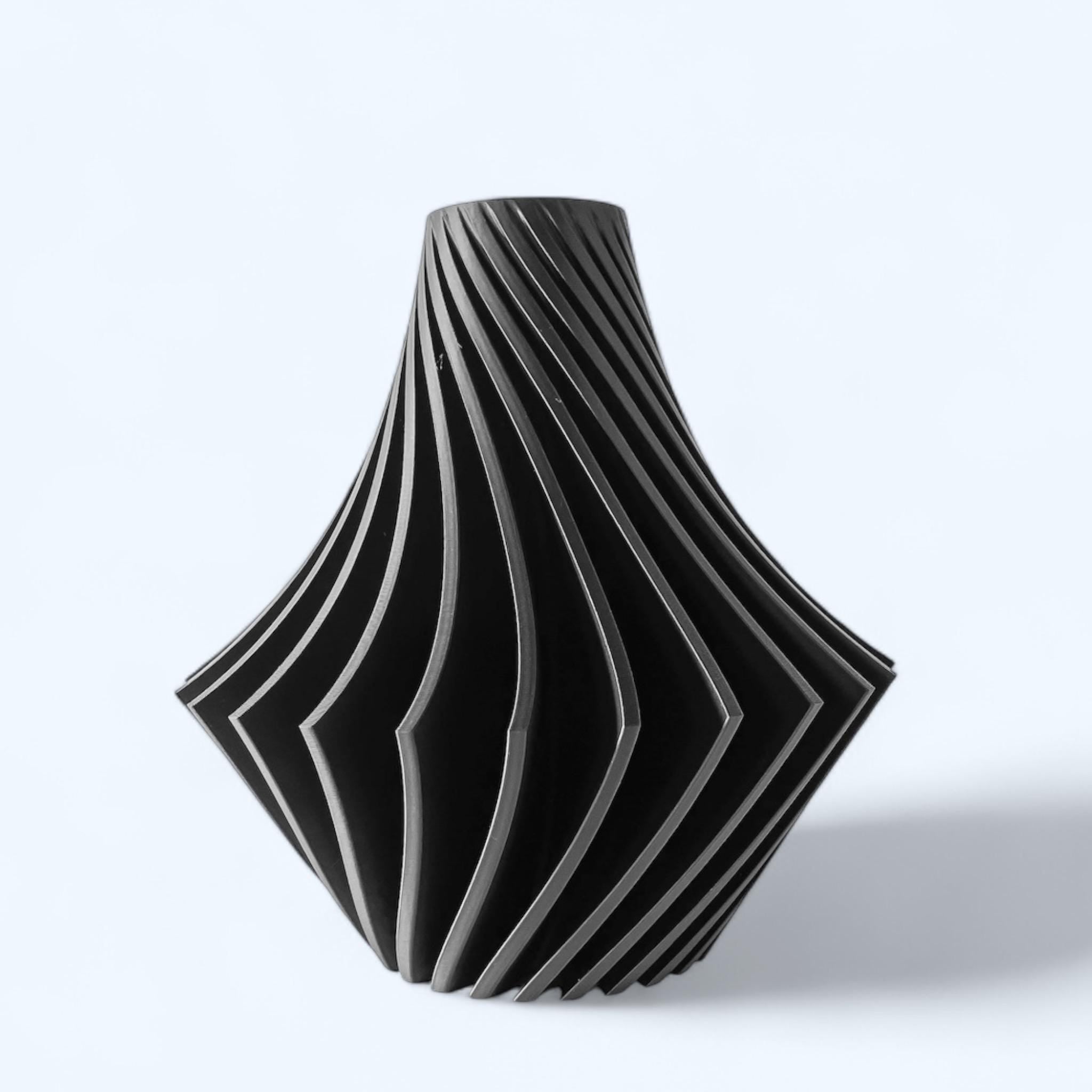 Black Spiral Vase with white and blue flowers – twisted geometric sculptural centerpiece
