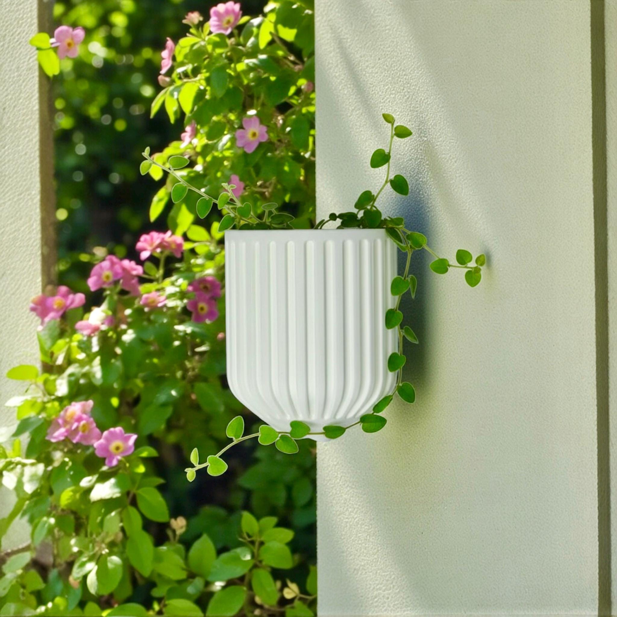 White Nordic Wall Vase on brick wall with trailing greenery – Scandinavian wall decor