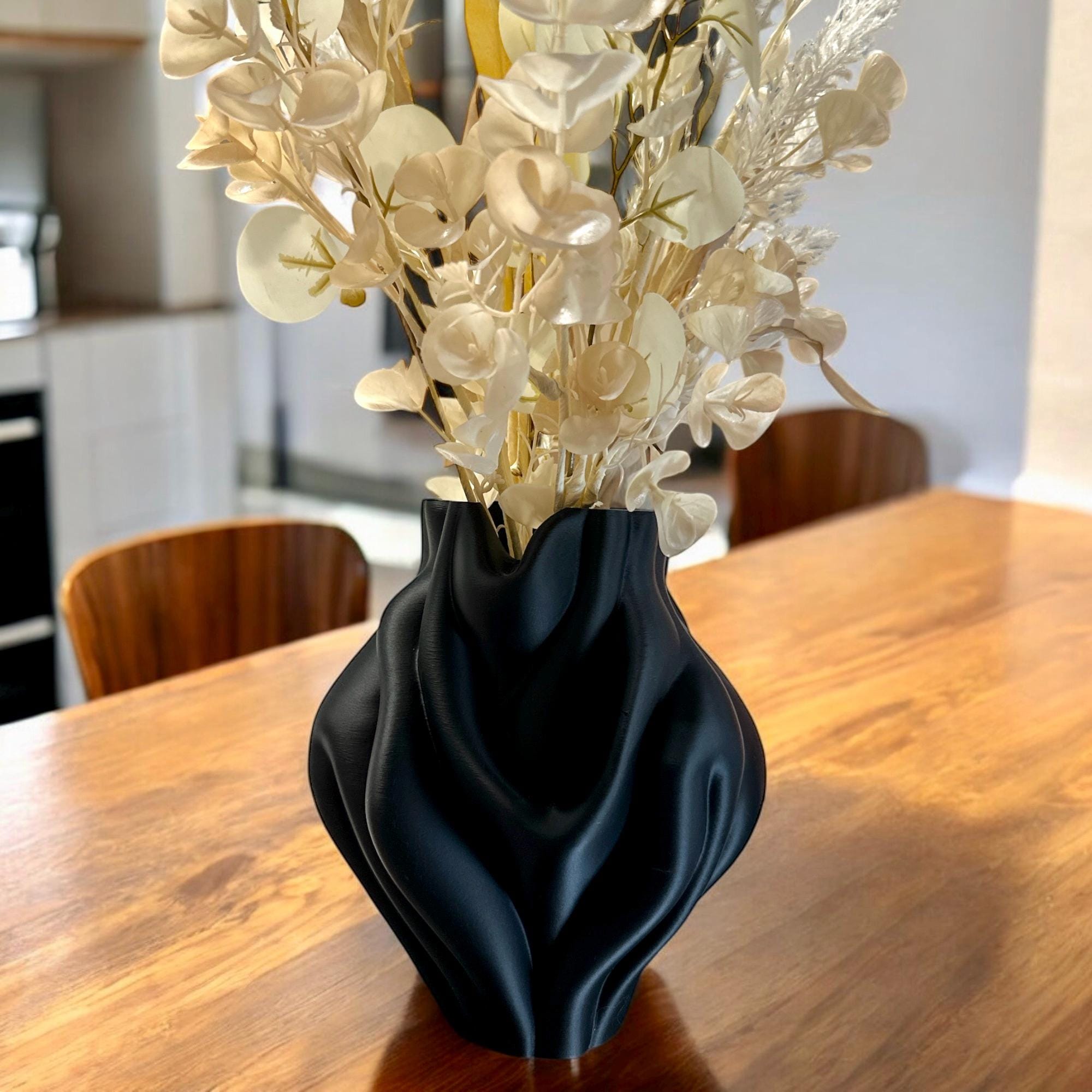 Black Ripple Bubblegum Vase styled with dried botanicals on dining table