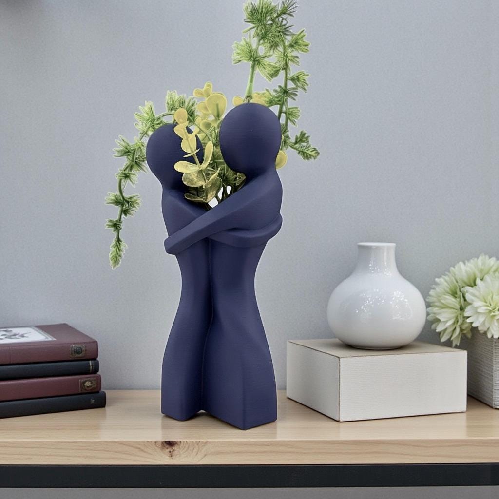 Black Embrace Vase styled with dried botanicals – figural love symbol decor