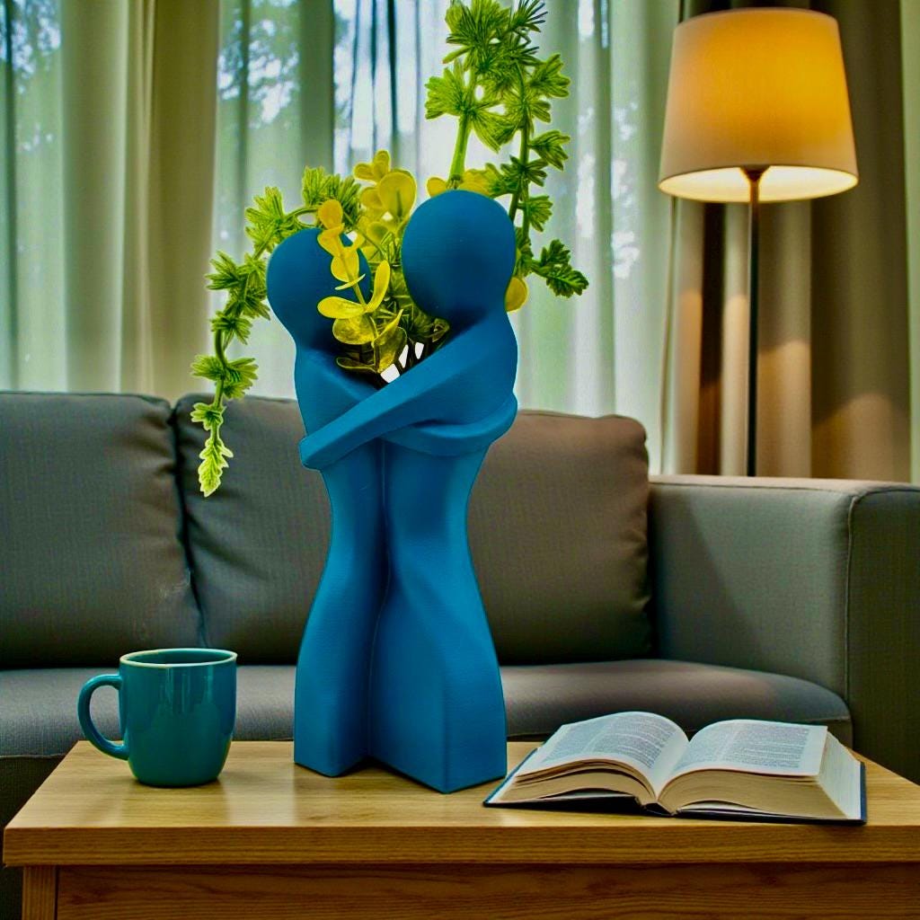 Marine Blue Embrace Vase styled with dried botanicals – figural love symbol decor