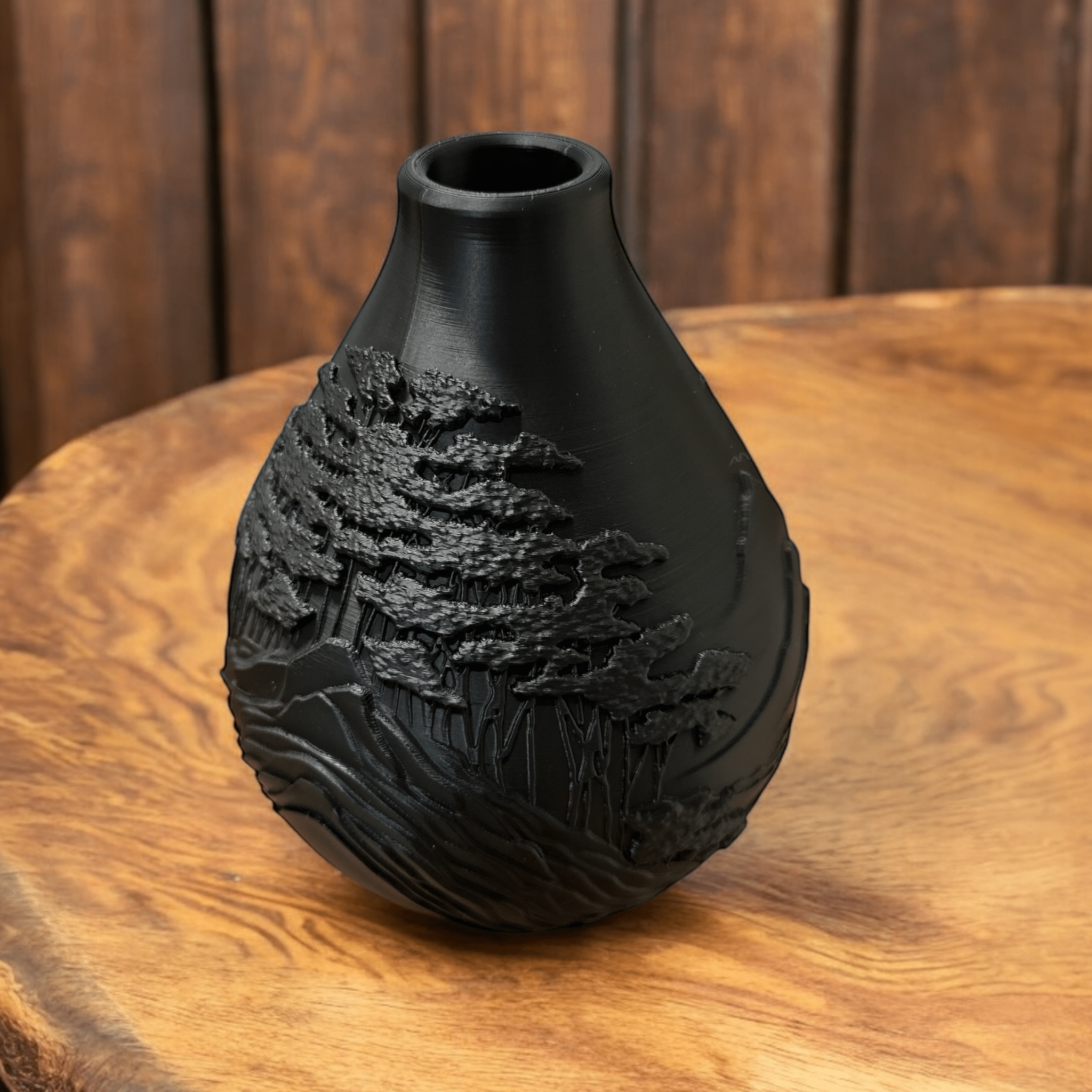 Black mountain vase with dried flowers by Pashmation