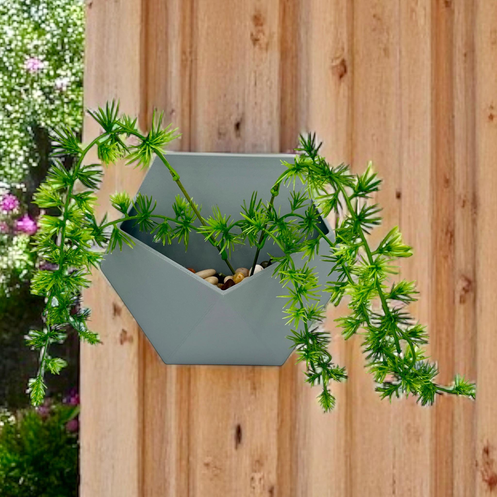 Geometric Wall Planter on wood-paneled wall – hexagonal prism faceted planter