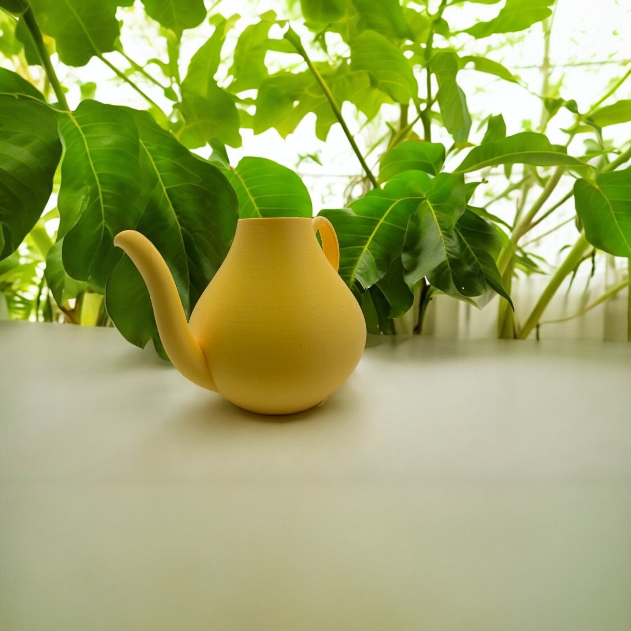 Yellow Modern Watering Can in window with greenery – modern sculptural watering can