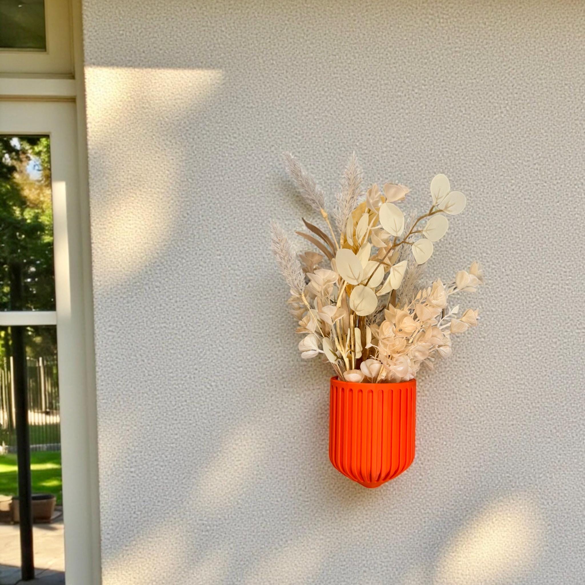 Orange Nordic Wall Vase – ribbed sculptural wall-mounted shield-form vase