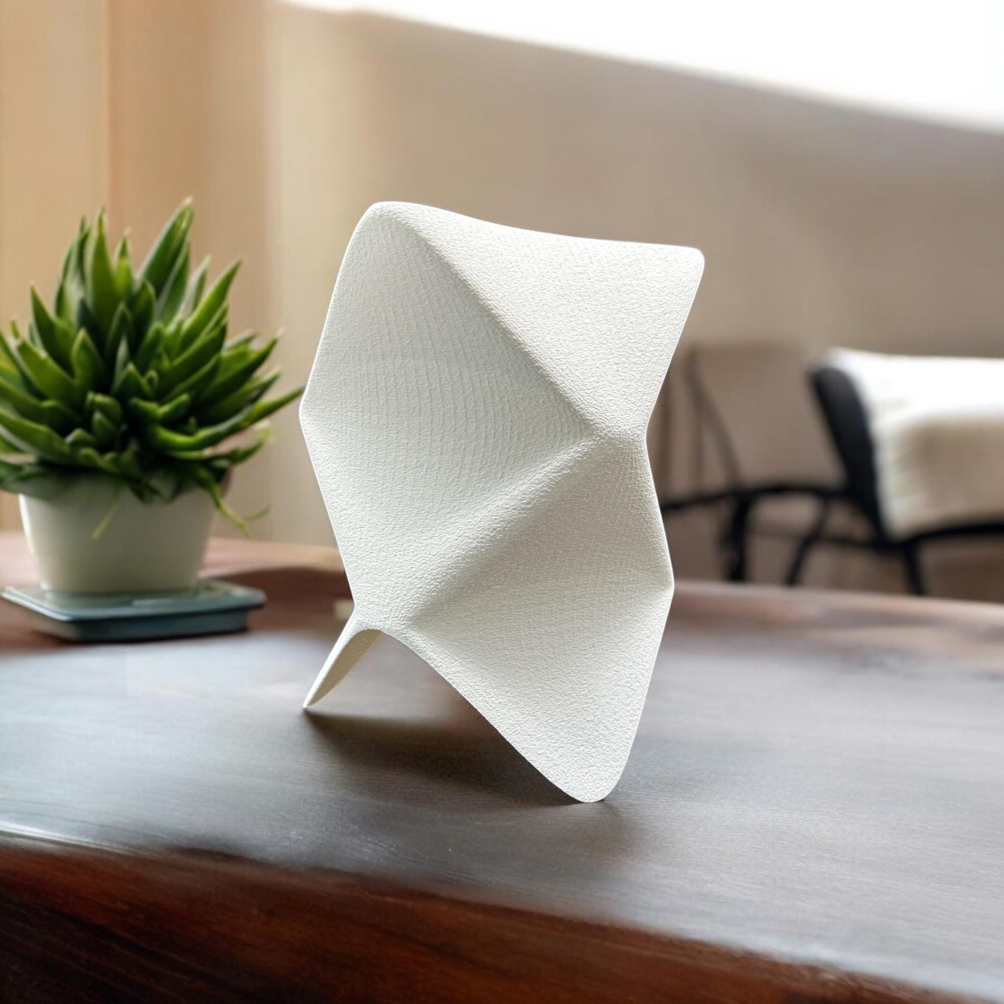 White origami table lamp with geometric folded design by Pashmation