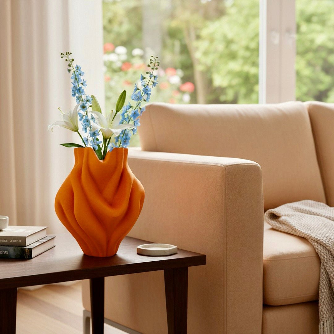 Orange Ripple Bubblegum Vase styled with branches – bulbous sculptural decor