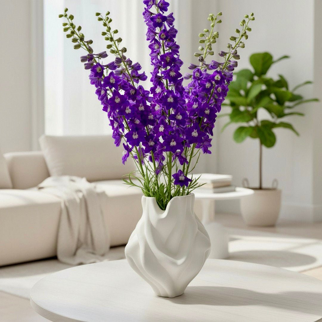 White Ripple Bubblegum Vase styled with branches – bulbous sculptural decor
