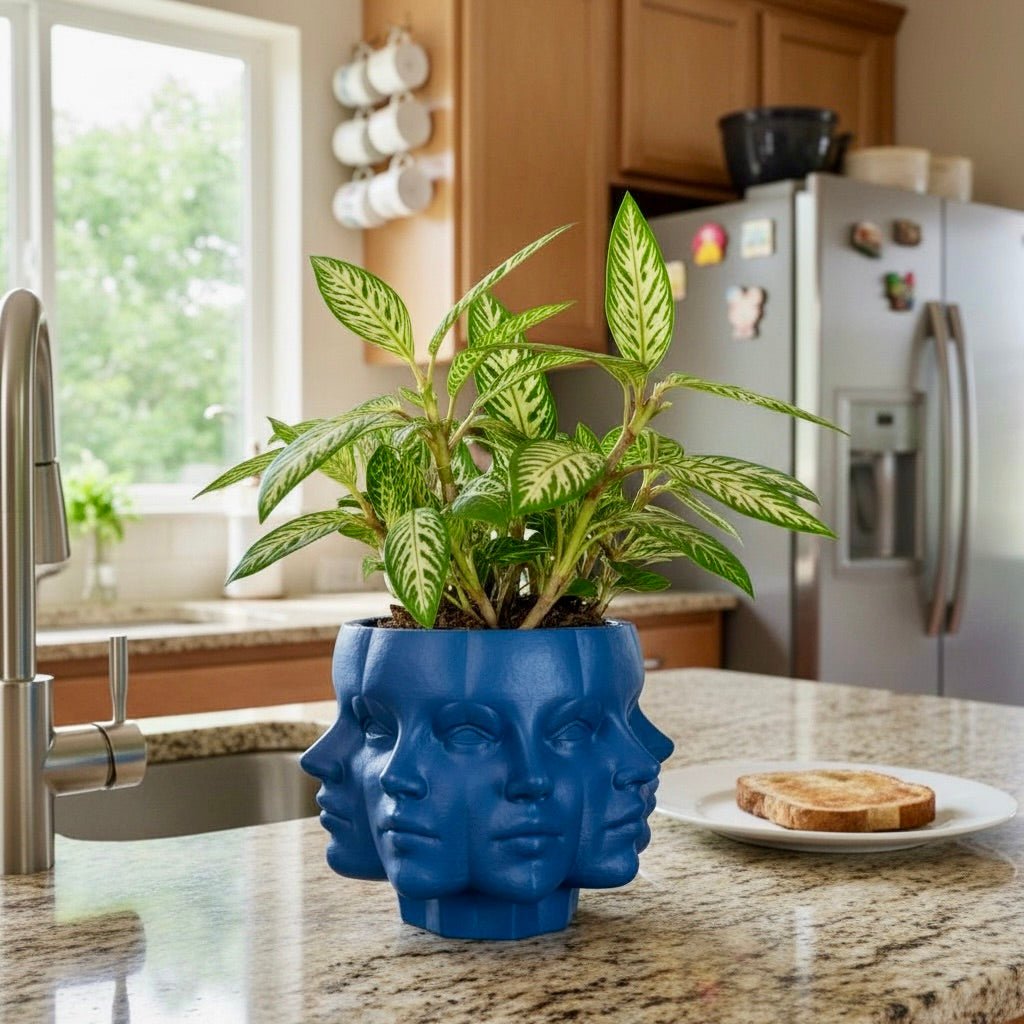 Blue Multi-Face Planter with houseplant – figural sculptural planter