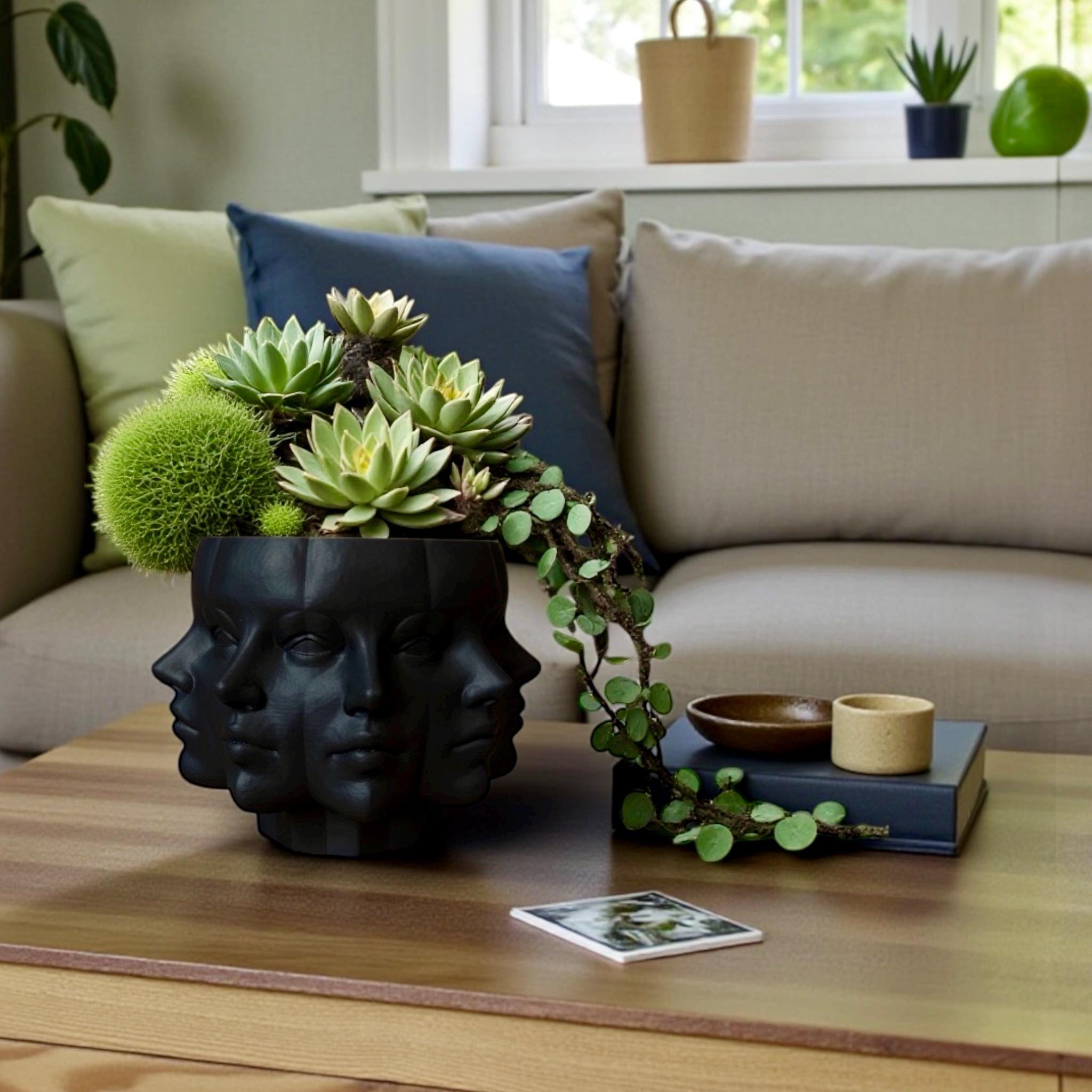 Black Multi-Face Planter with foliage – sculptural figural planter