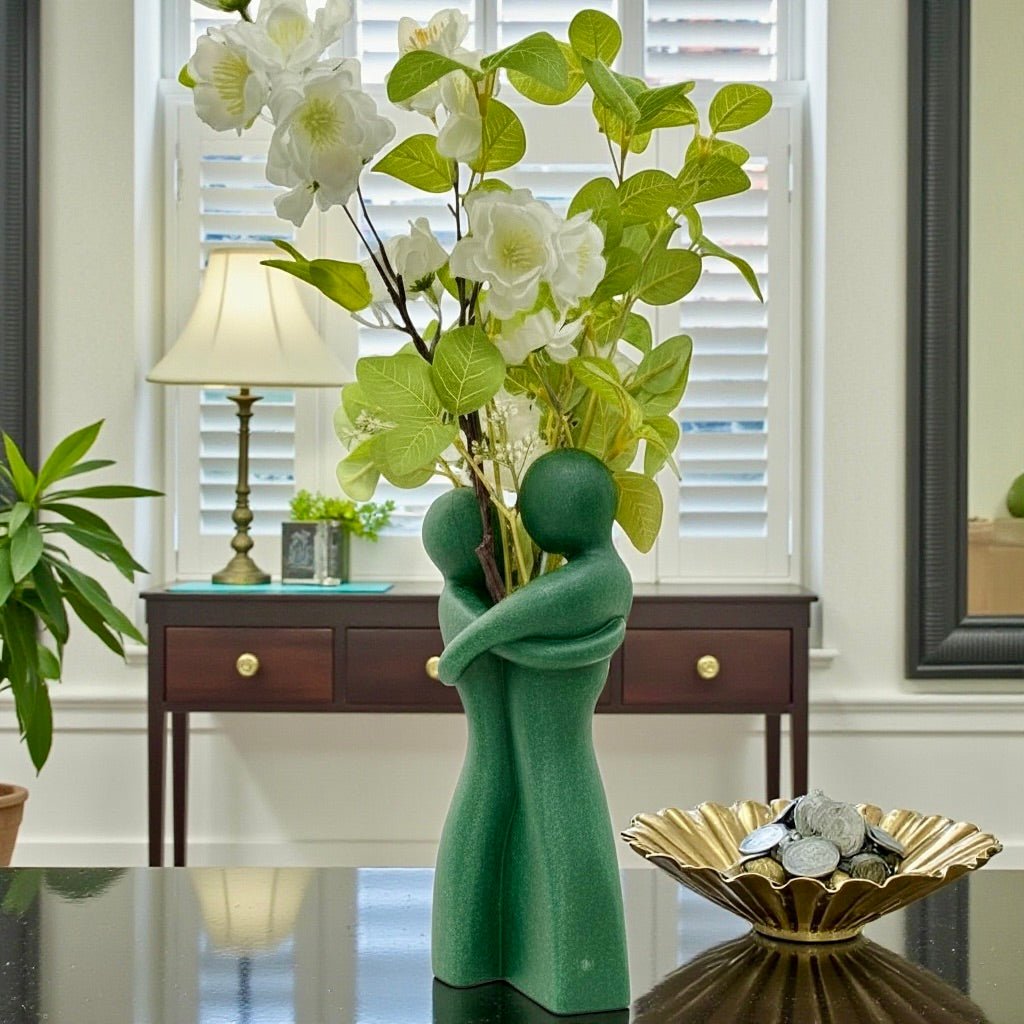 Embrace Vase styled with dried botanicals – figural love symbol decor