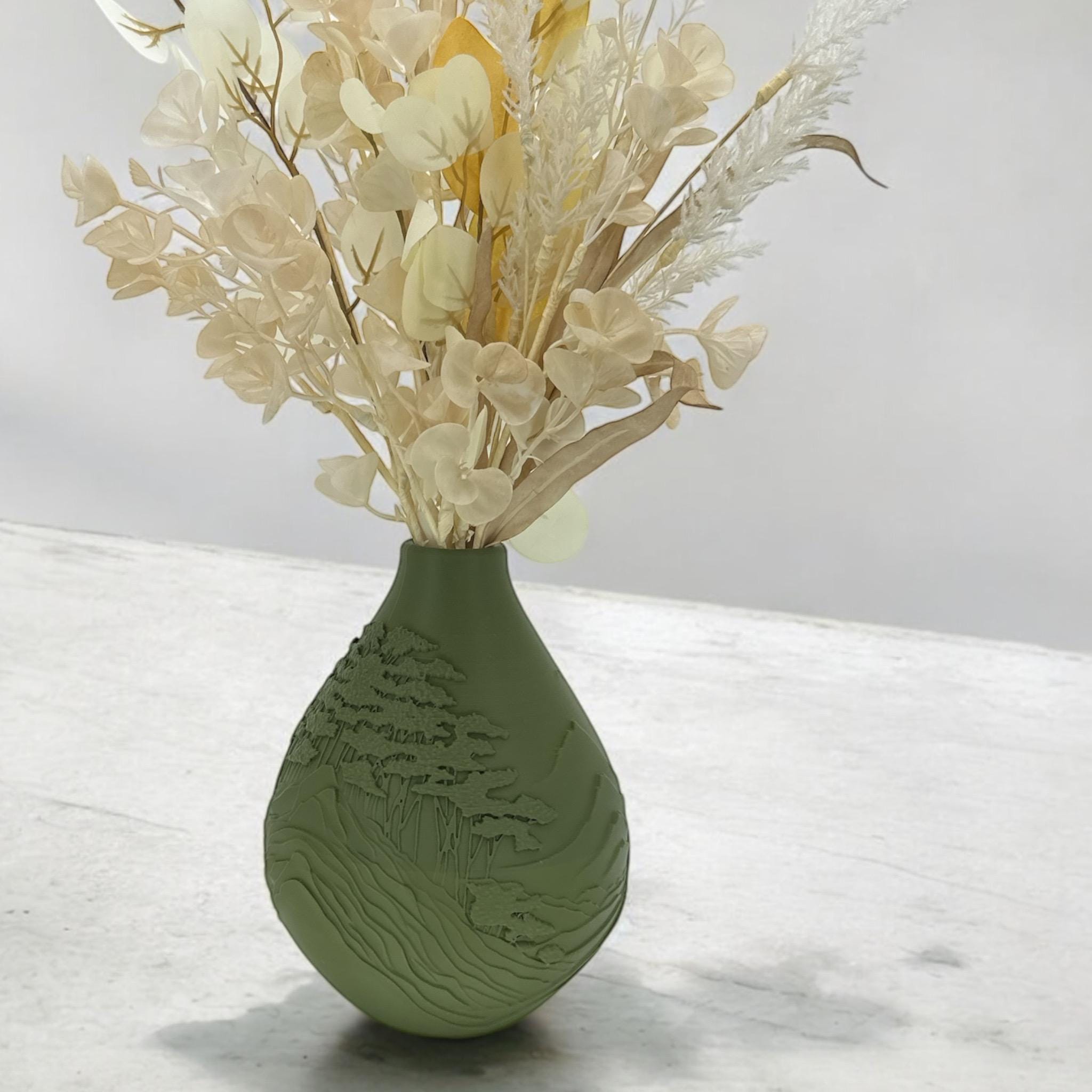 Green mountain vase with dried flowers by Pashmation