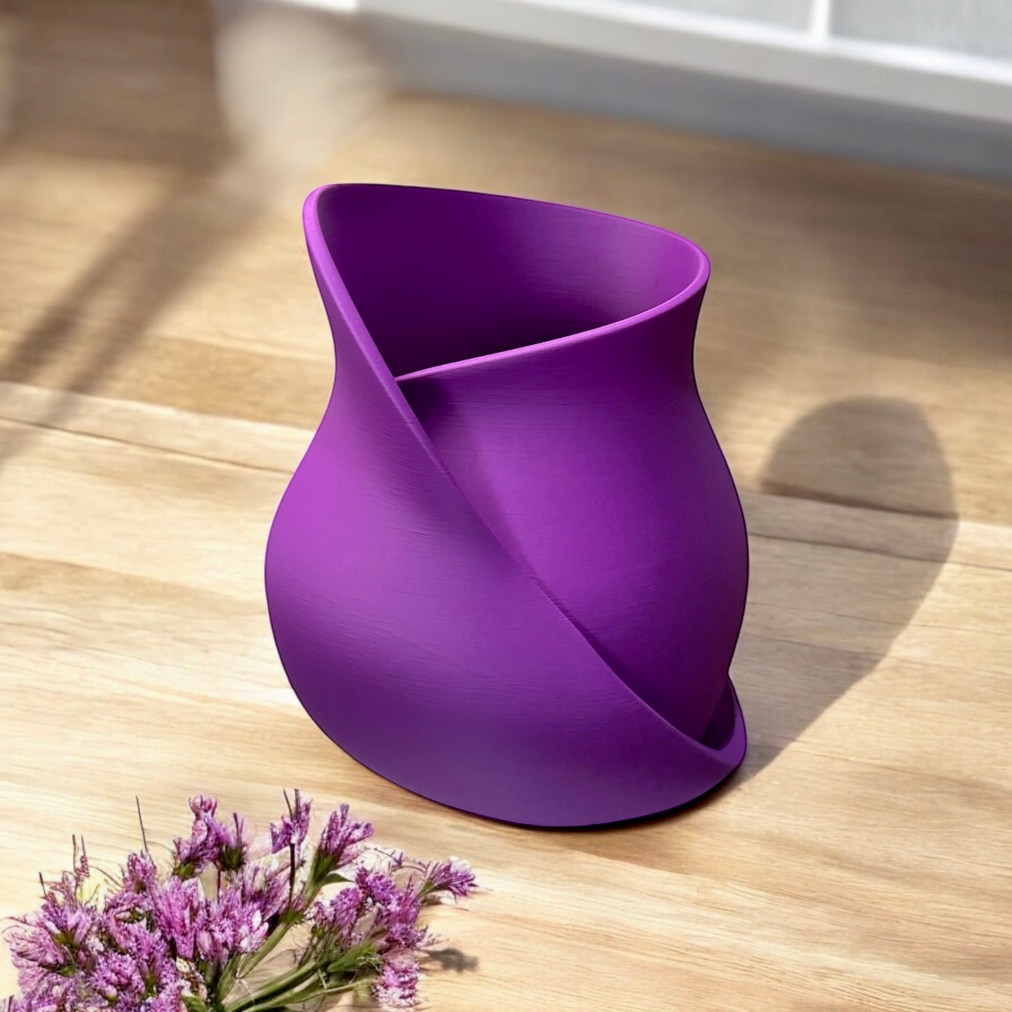 Purple twisted ribbon vase close-up with curved texture by Pashmation