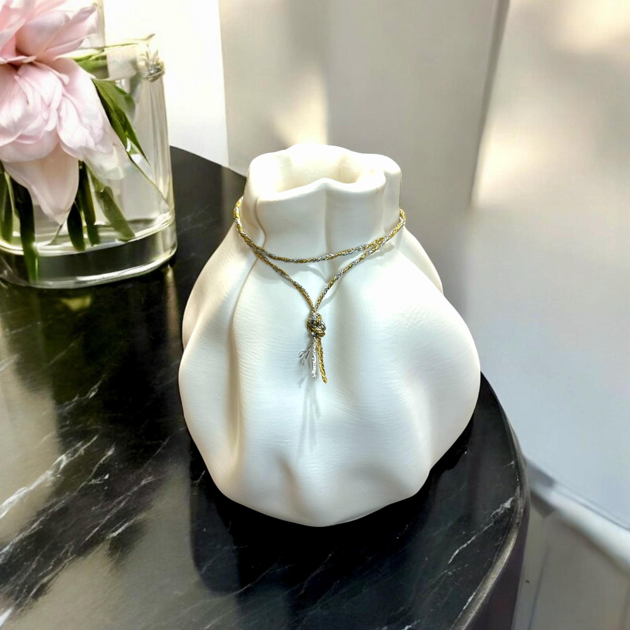 White Cinched Wave Vase with peonies on marble – cinched top with cord detail